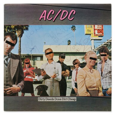 View full screen - View 1 of Lot 66. AC/DC | A signed copy of "Dirty Deeds Done Dirt Cheap".