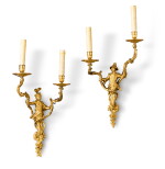 A pair of Régence style gilt-bronze two-light wall-lights, 19th century | Paire d'appliques à deux lumières en bronze doré de style Régence, XIXe siècle