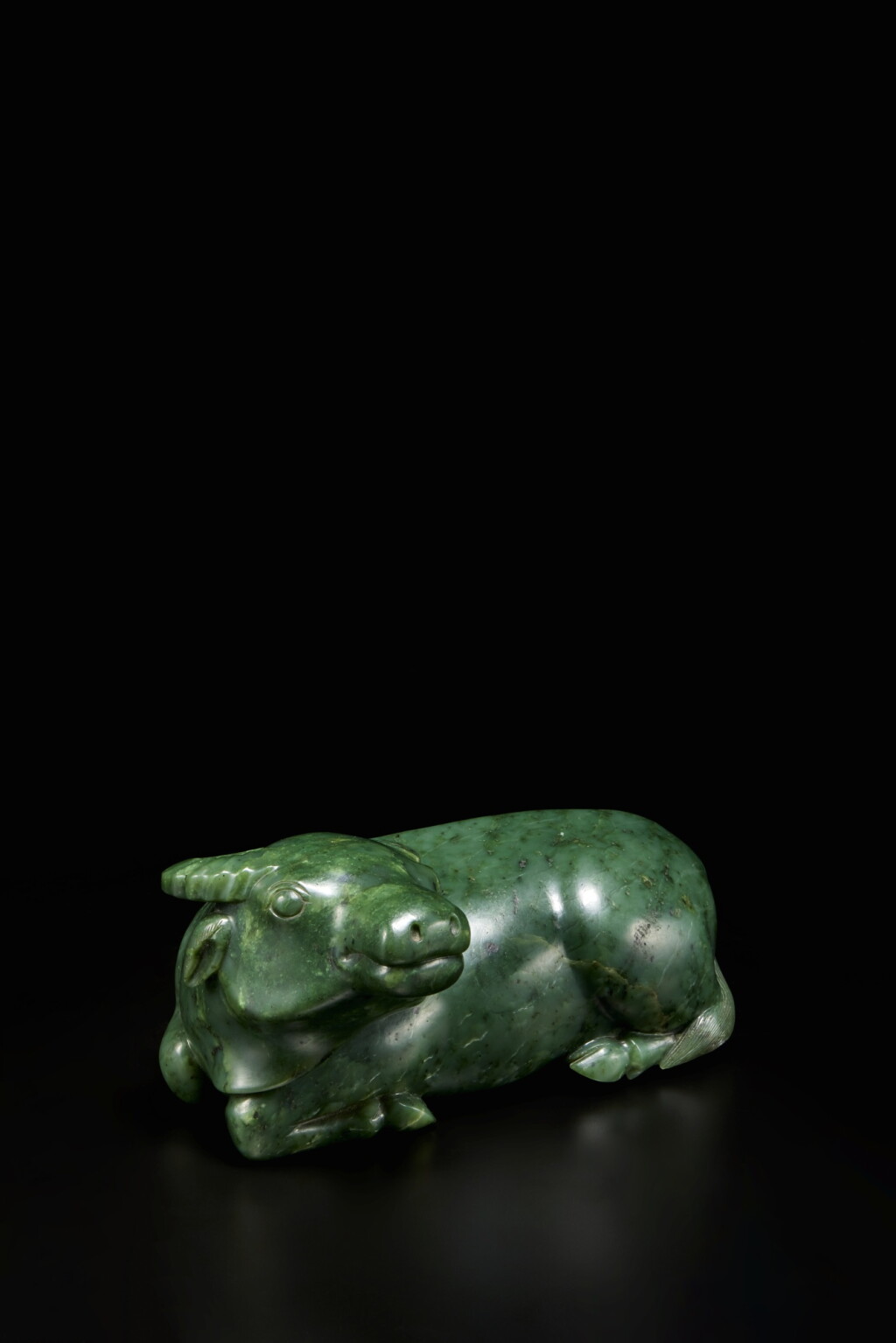 View full screen - View 1 of Lot 385. A rare spinach green jade buffalo, Qing dynasty, Qianlong period.