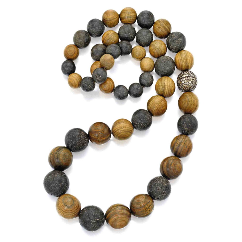 View full screen - View 1 of Lot 211. Wood, Amber and Colored Diamond Necklace.