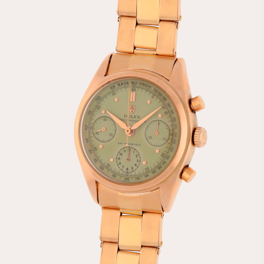 View full screen - View 1 of Lot 124. Reference 6034 | A pink gold chronograph wristwatch with bracelet | Circa 1954.