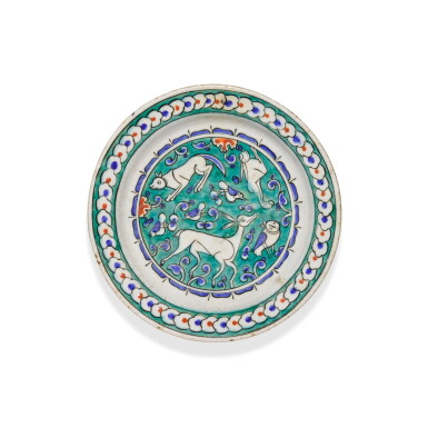 View full screen - View 1 of Lot 136. A small Iznik polychrome pottery dish with animals, Turkey, circa 1580.
