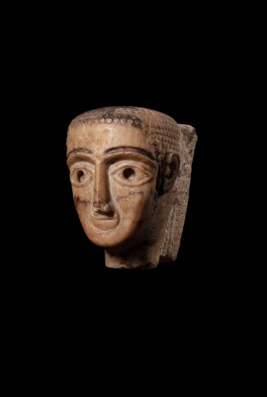 View full screen - View 1 of Lot 14. A South Arabian Veined Alabaster Head of a Man or Woman, 3rd Century B.C./1st Century A.D..