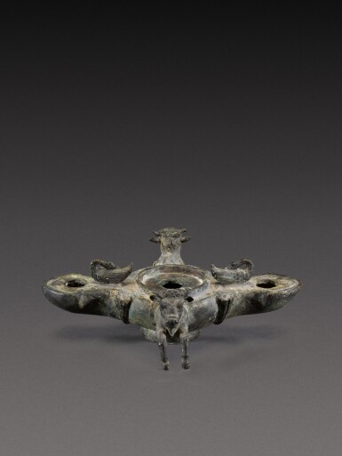 View full screen - View 1 of Lot 103. A Roman Bronze Oil Lamp, 1st Century A.D..