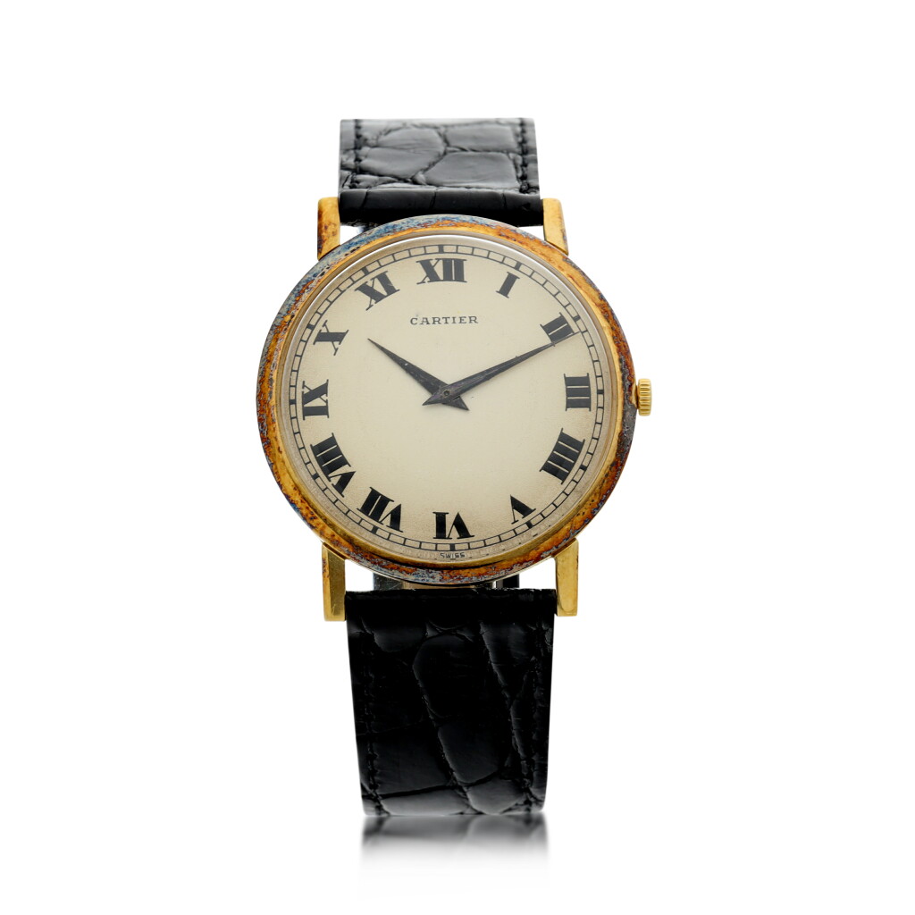 View full screen - View 1 of Lot 71. RETAILED BY CARTIER: A YELLOW GOLD WRISTWATCH, CIRCA 1970.