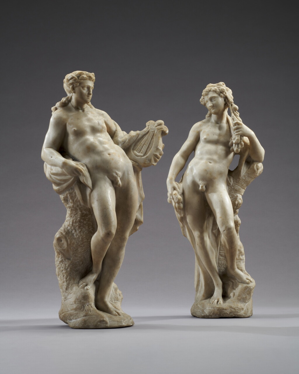 View full screen - View 1 of Lot 15. Venice, circa 1720-1730, pair of figures depicting Apollo and Bacchus.
