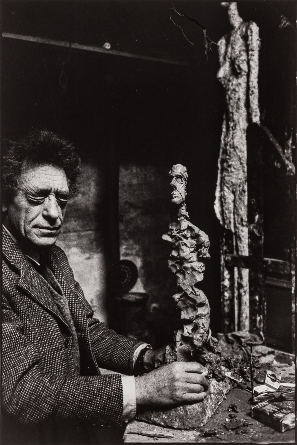 View full screen - View 1 of Lot 32. Alberto Giacometti in his studio, rue Hippolyte Maindron, Paris.