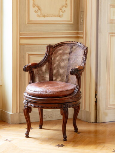 View full screen - View 1 of Lot 31. A Louis XVI walnut fauteuil de bureau à assise tournante, circa 1780, attributed to Georges Jacob | Fauteuil de bureau à assise tournante en noyer d'époque Louis XVI, vers 1780, attribué à Georges Jacob.