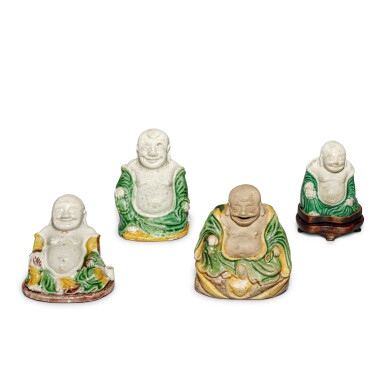 View full screen - View 1 of Lot 606. A group of four famille-verte biscuit figures of Budai, Qing dynasty, Kangxi period | 清康熙 素三彩布袋和尚坐像一組四件.
