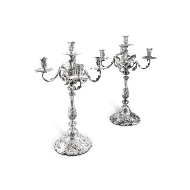 View full screen - View 1 of Lot 94. A pair of large Dutch silver five-light candelabra, L.J. Limburg, Amsterdam, circa 1910 | Paire de grands chandeliers à cinq lumières en argent par L.J. Limburg, Amsterdam, vers 1910.