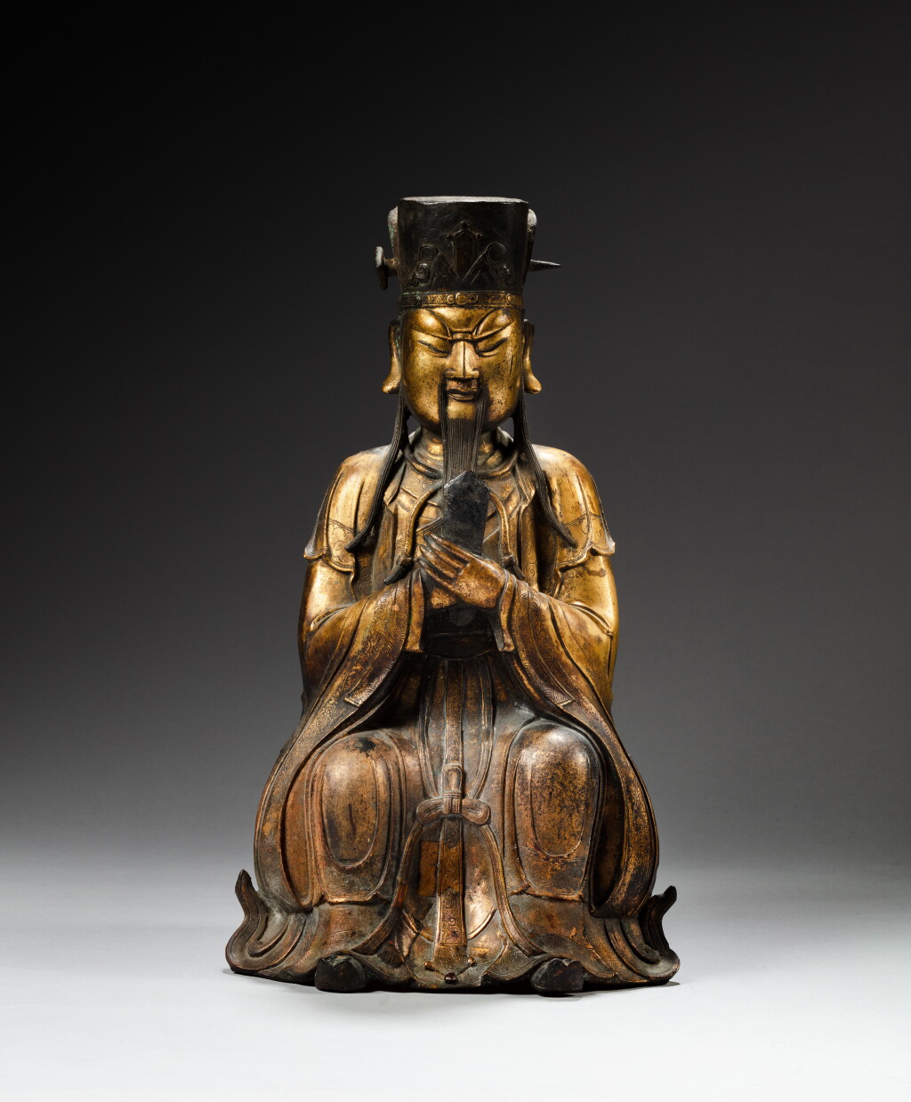 View full screen - View 1 of Lot 197. A large gilt-bronze figure of a high Daoist official, 16th / 17th century | 十六至十七世紀 銅鎏金天官坐像.
