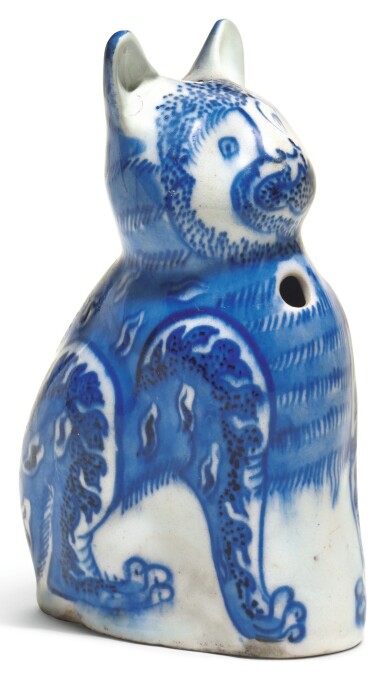View full screen - View 1 of Lot 118. A SAFAVID BLUE AND WHITE PORCELAIN CAT, PERSIA, 17TH CENTURY.
