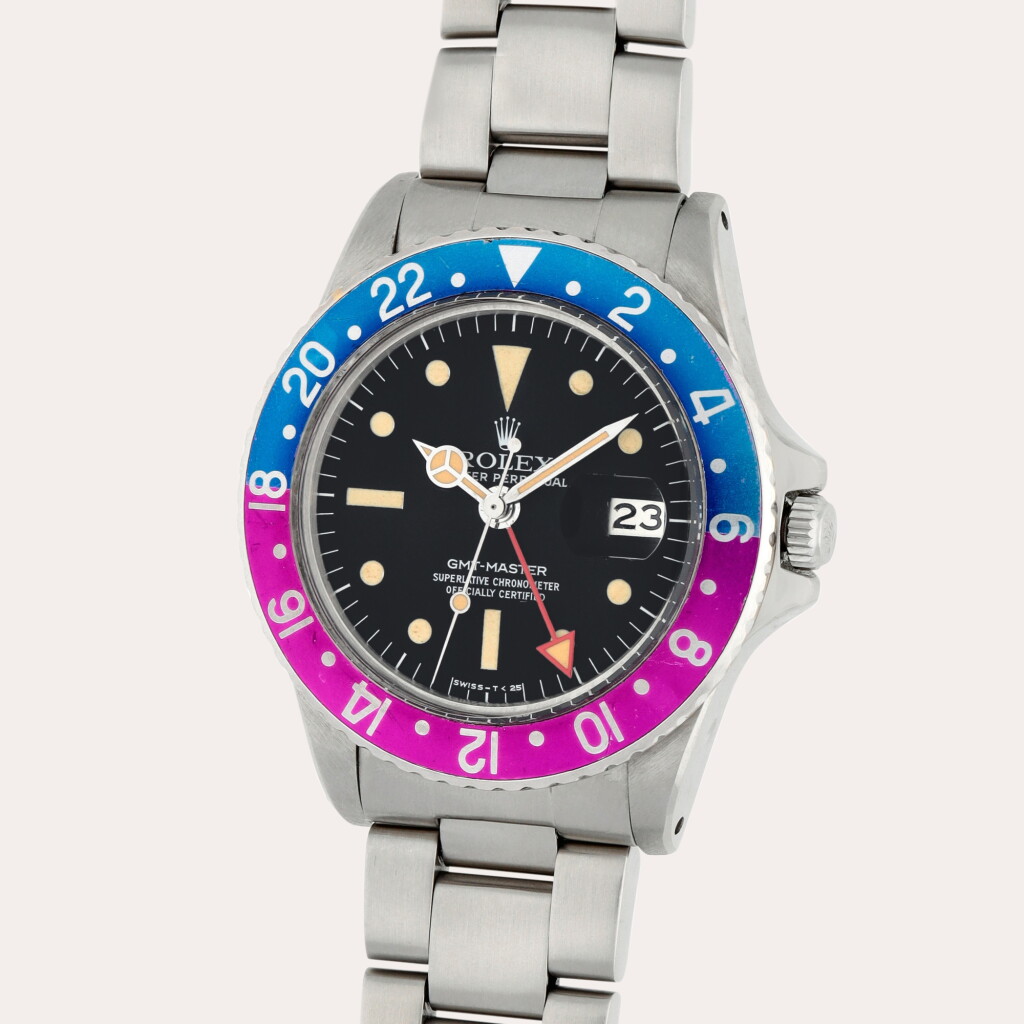 View full screen - View 1 of Lot 112. GMT-Master ‘Fuchsia’, Reference 1675 | A stainless steel dual time zone wristwatch with date and bracelet | Circa 1979.