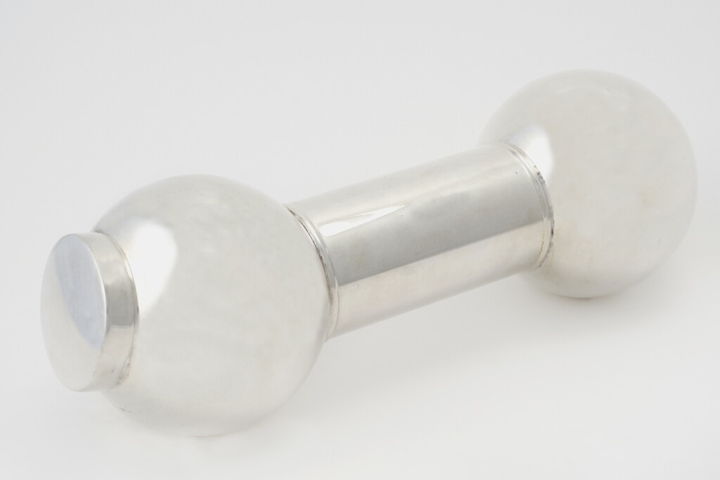 View full screen - View 1 of Lot 36. AN ENGLISH SILVER-PLATED DUMBELL-FORM COCKTAIL SHAKER.