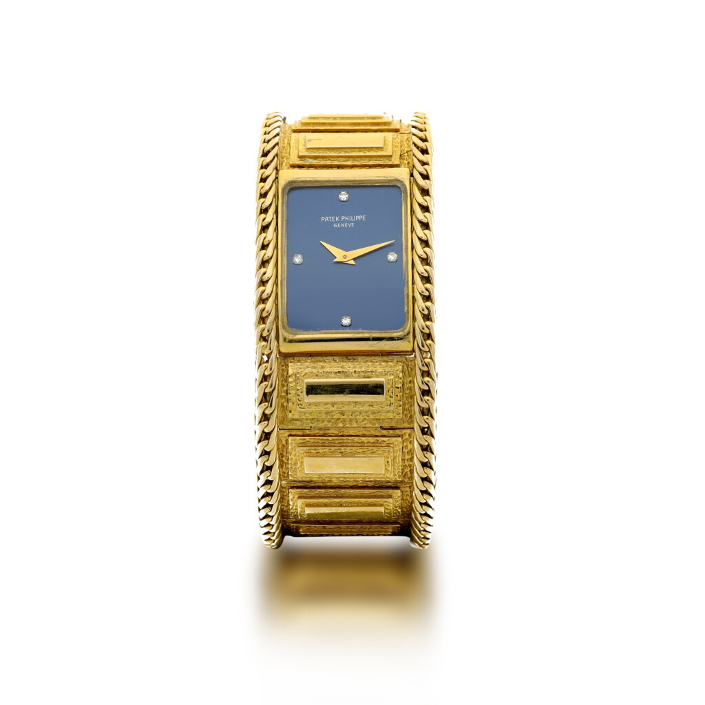 View full screen - View 1 of Lot 59. PATEK PHILIPPE | REFERENCE 4241 A YELLOW GOLD RECTANGULAR BRACELET WATCH WITH DIAMOND-SET INDEXES, MADE IN 1984 .