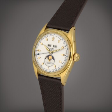 View full screen - View 1 of Lot 7. Reference 6062 | A yellow gold triple calendar wristwatch with moon phases | Circa 1953.