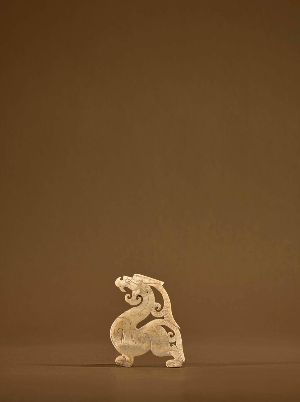 View full screen - View 1 of Lot 108. A jade 'dragon' plaque, Eastern Zhou dynasty .