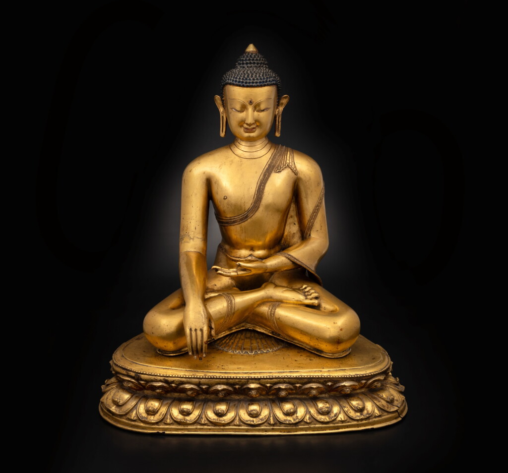 View full screen - View 1 of Lot 563. A magnificent large gilt copper alloy figure of Shakyamuni Buddha, Central Tibet, 14th century.