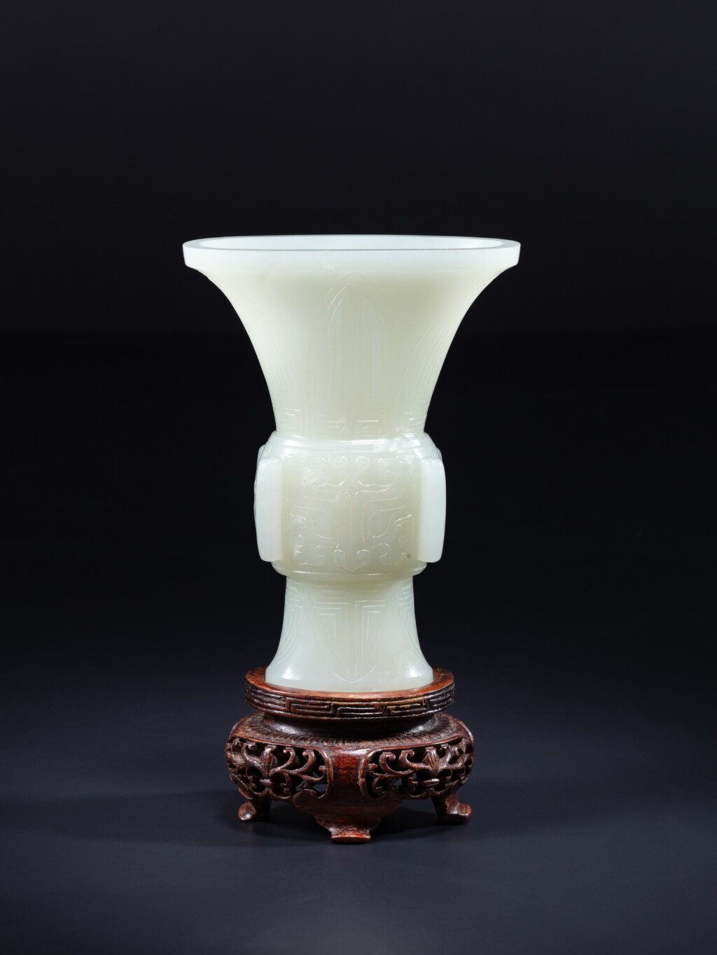 View full screen - View 1 of Lot 123. A white jade 'taotie' gu-form vase, Qing dynasty, Qianlong period.