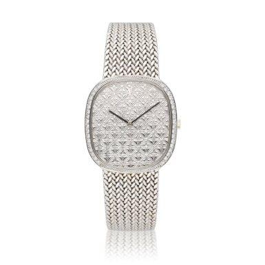 View full screen - View 1 of Lot 142. A white gold and diamond-set cushion shaped bracelet watch, Circa 1980.