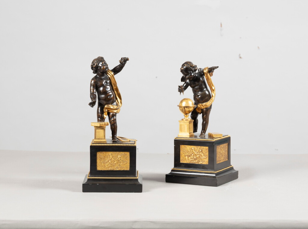 View full screen - View 1 of Lot 121. A pair of gilt-bronze patinated putti, late 18th century | Paire de putti en bronze patiné et doré de la fin du XVIIIème siècle.
