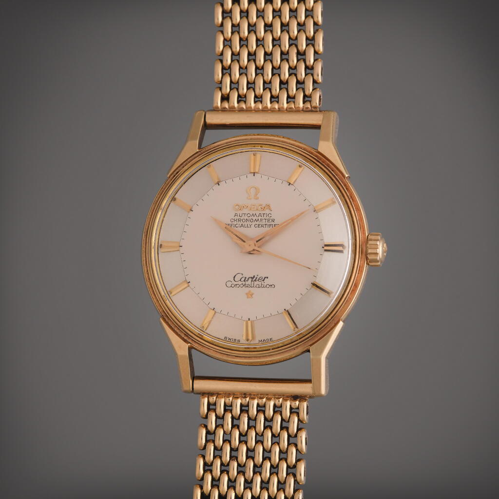 View full screen - View 1 of Lot 43. Reference 14900 SC Constellation 'Pie Pan' | Retailed by Cartier: A yellow gold automatic wristwatch with bracelet, Circa 1962.