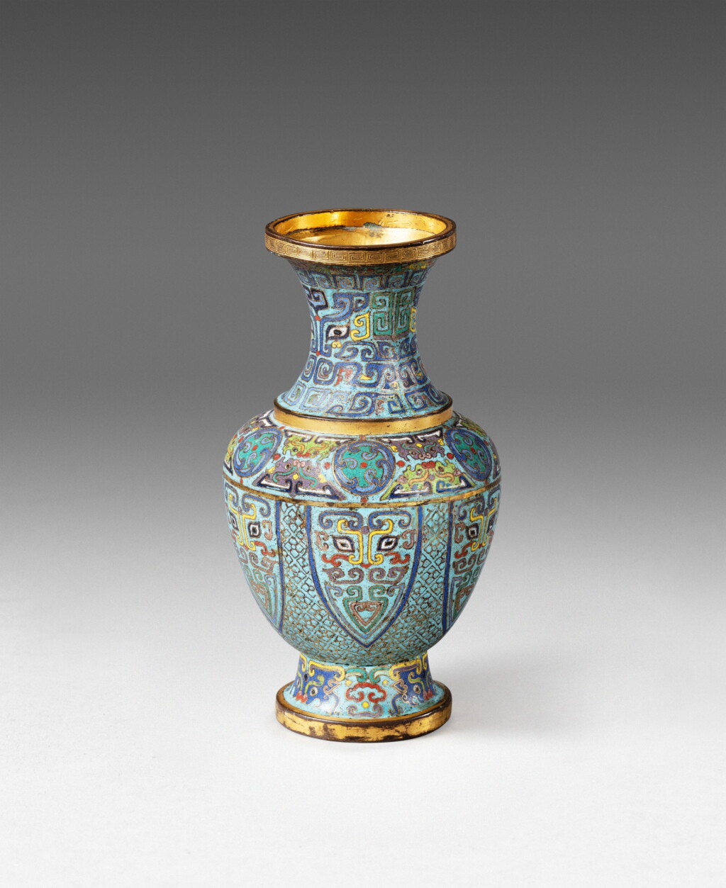View full screen - View 1 of Lot 50. A finely decorated imperial gilt-bronze and cloisonné enamel archaistic vase Qing dynasty, Qianlong period, Jingtai mark | 清乾隆 掐絲琺瑯仿古饕餮紋瓶 《景泰年製》款.