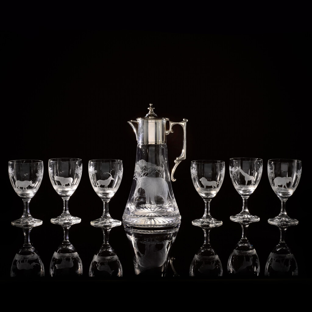 View full screen - View 1 of Lot 80. A silver-mounted claret jug and set of six glasses, maker's mark WW, London, 2004.