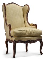 A LOUIS XV CARVED WALNUT BERGÈRE À OREILLES CIRCA 1750