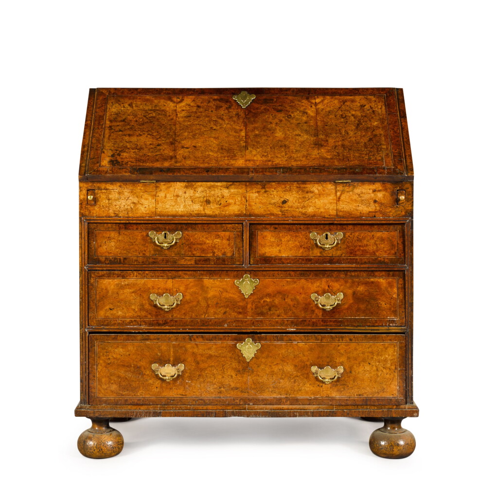 View full screen - View 1 of Lot 78. A George I burr walnut and yew-wood-banded bureau, circa 1725.