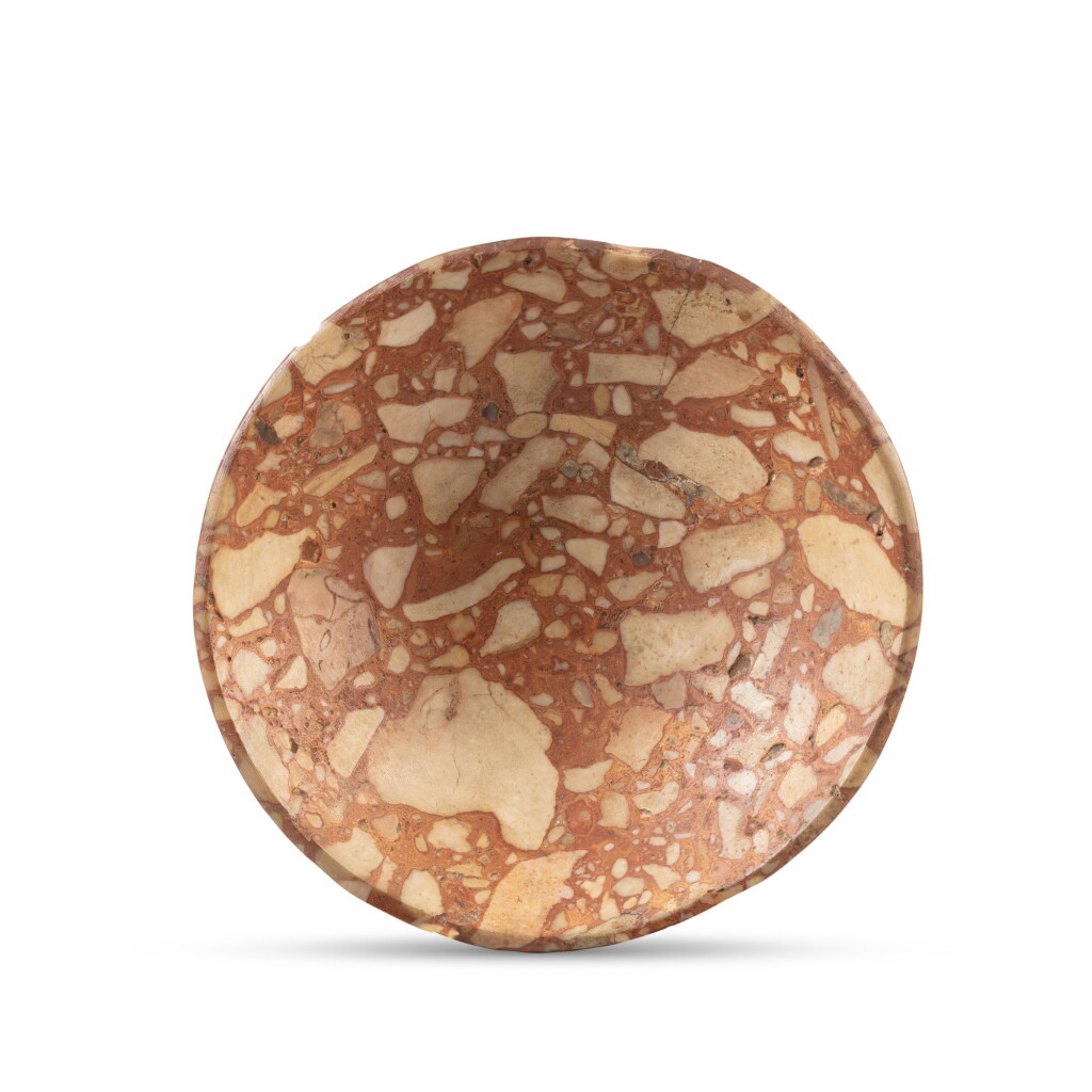 View full screen - View 1 of Lot 22. An Egyptian Breccia Dish, 1st/2nd Dynasty, circa 2965-2750 B.C. | Coupelle en brèche, art égyptien, Ière/IIe dynastie, vers 2965-2750 avant J.-C..