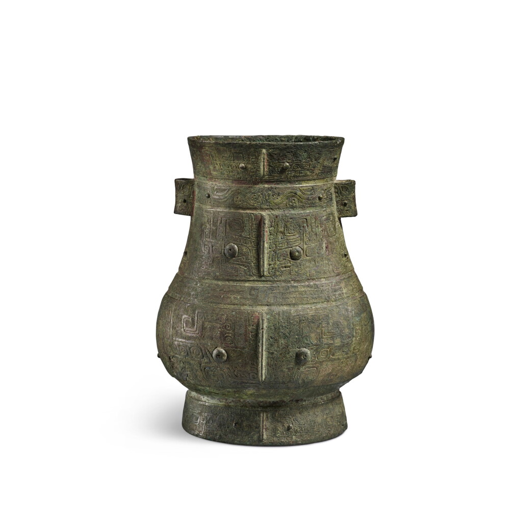 View full screen - View 1 of Lot 8. A magnificent and rare archaic bronze ritual wine vessel (Hu), Late Shang dynasty | 商末 青銅饕餮紋壺.