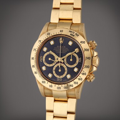 View full screen - View 1 of Lot 365. Reference 16528 Daytona | A yellow gold and diamond-set automatic chronograph wristwatch with bracelet, Circa 1995.