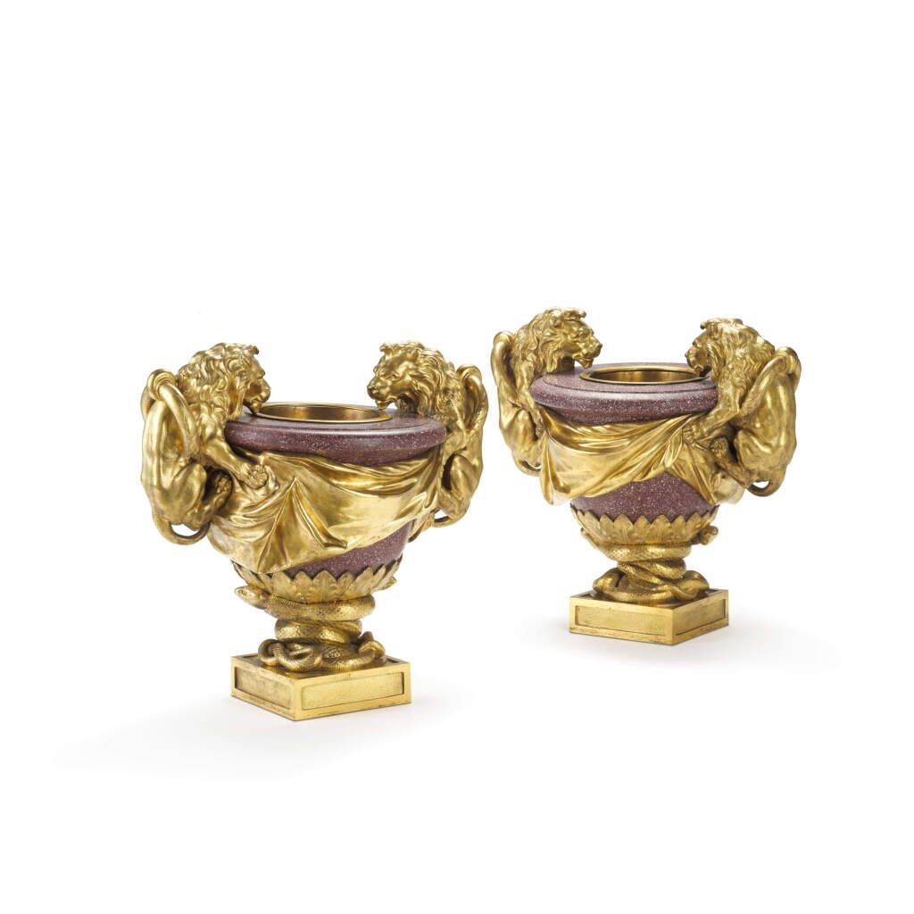 View full screen - View 1 of Lot 47. A pair of Louis XVI gilt-bronze mounted egyptian red porphyry vases “au lion”, circa 1780, after a drawing by Ennemond-Alexandre Petitot.