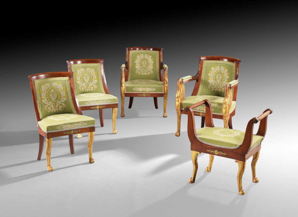 View full screen - View 1 of Lot 10. An Empire suite of gilt-bronze mounted parcel-gilt and carved mahogany seating furniture, early 19th century | Suite de siège Empire en acajou sculpté et doré, début du XIXe siècle.