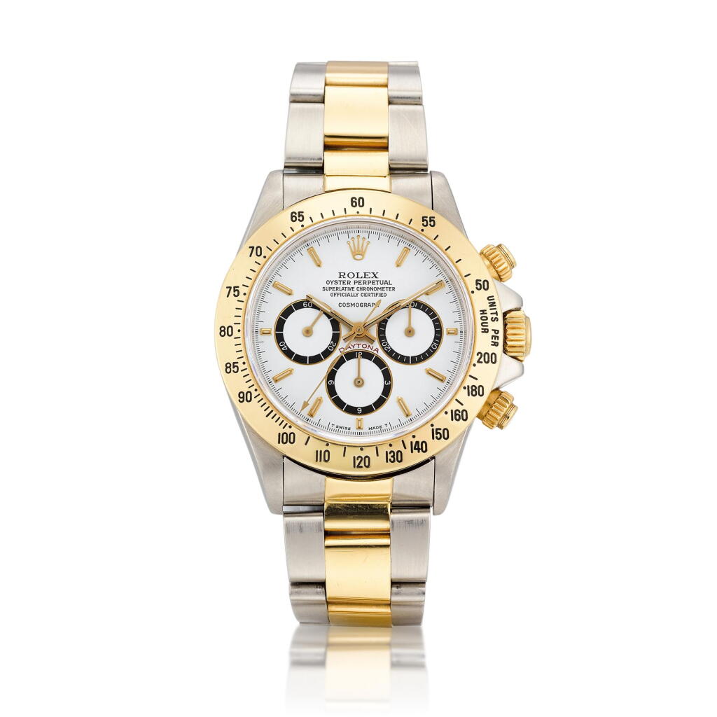 View full screen - View 1 of Lot 2071. Cosmograph Daytona, Reference 16523 | A yellow gold and stainless steel chronograph wristwatch with suspended logo and bracelet, Circa 1988, Formerly in the Collection of Eric Clapton, CBE | 勞力士 | "Floating" Cosmograph Daytona 型號16523 | 黃金及精鋼計時鏈帶腕錶,備懸浮標誌,約1988年製,原為 Eric Clapton, CBE 收藏.