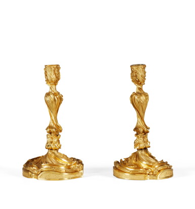 View full screen - View 1 of Lot 75. A Louis XV style gilt-bronze candlesticks, in the taste of Juste-Aurèle Meissonier | Paire de flambeaux en bronze ciselé et doré de style Louis XV, dans le goût de Juste-Aurèle Meissonier.