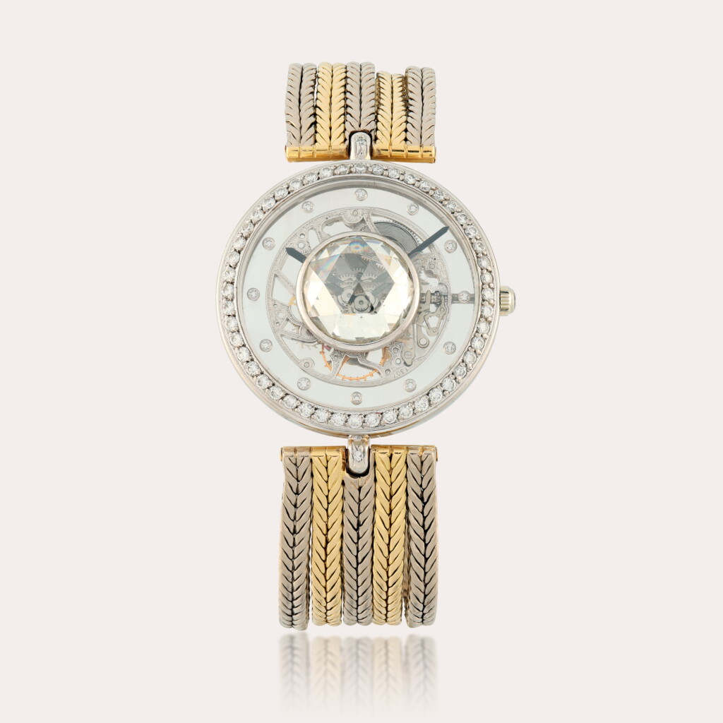 View full screen - View 1 of Lot 284. Reference G2297 | A white and yellow gold and diamond-set skeletonised bracelet watch | Circa 1990 .