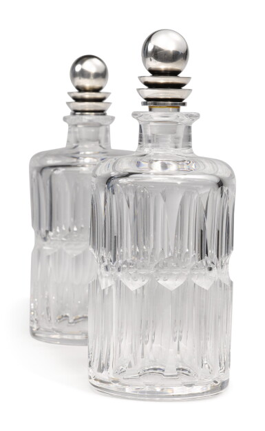 View full screen - View 1 of Lot 327. A PAIR OF GLASS DECANTERS WITH DANISH SILVER STOPPERS, NO. 206C, DESIGNED BY HARALD NIELSEN, GEORG JENSEN SILVERSMITHY, COPENHAGEN, CIRCA 1915-27.