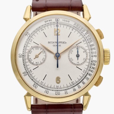 View full screen - View 1 of Lot 38. Reference 1579 'Spider Lugs' | A yellow gold chronograph wristwatch with two-tone dial, Made in 1947.