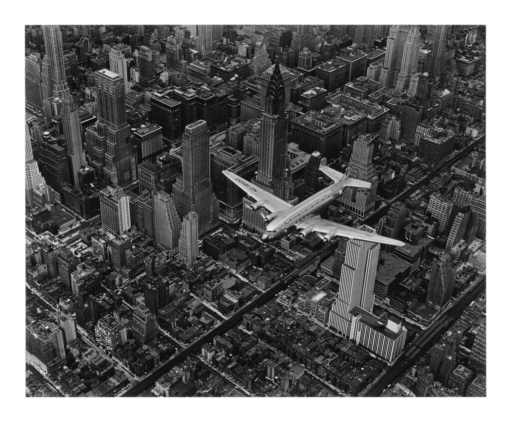 View full screen - View 1 of Lot 14. MARGARET BOURKE-WHITE | 'A DC-4 FLYING OVER NEW YORK CITY'.