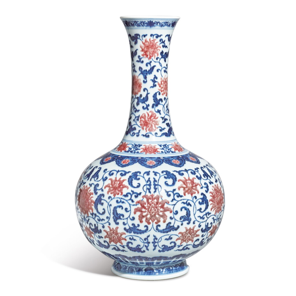 View full screen - View 1 of Lot 544. A FINE AND EXCEPTIONALLY RARE UNDERGLAZE-BLUE AND COPPER-RED 'LOTUS' BOTTLE VASE, QIANLONG SEAL MARK AND PERIOD.