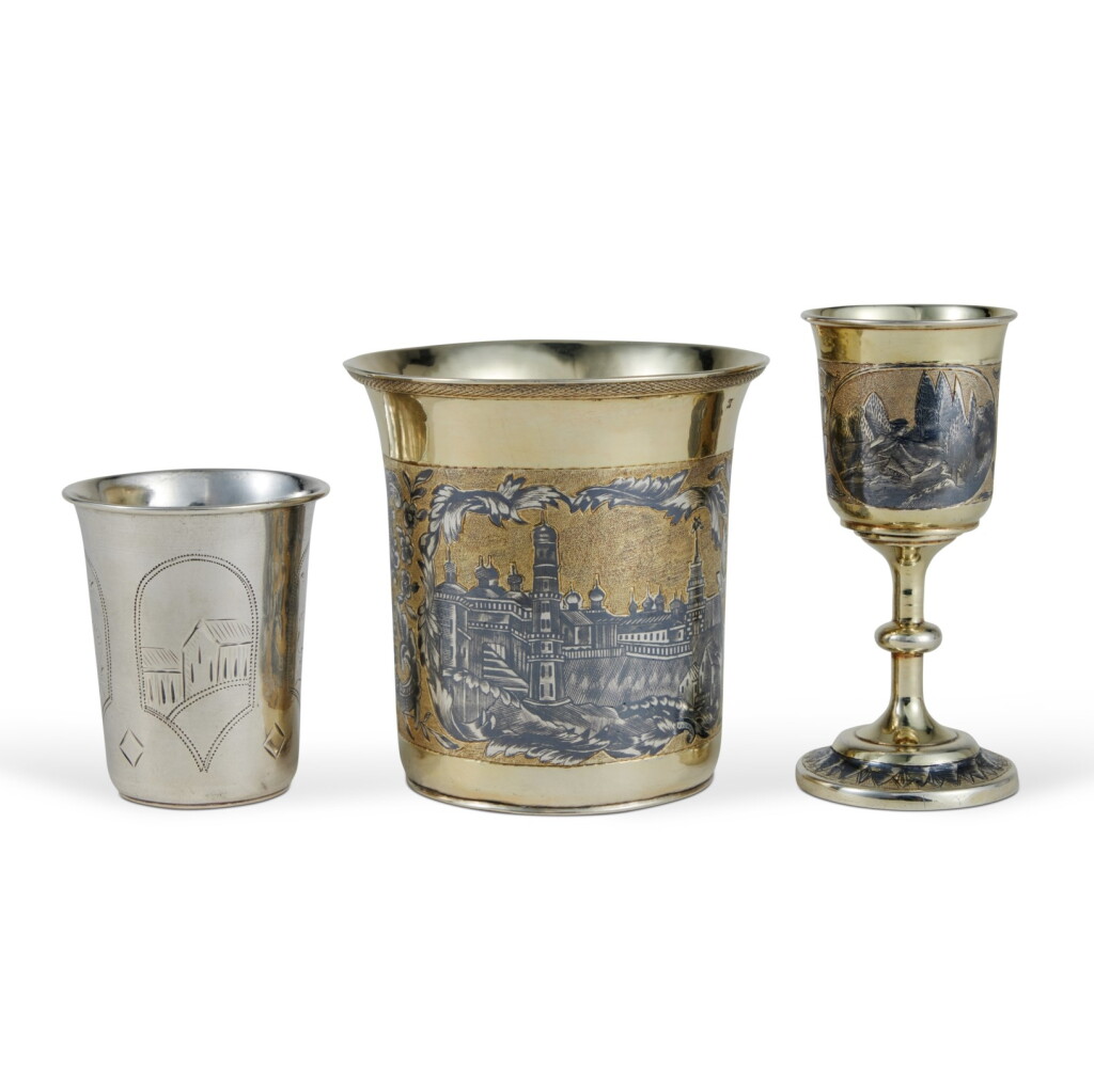 View full screen - View 1 of Lot 585. A Group of Three Silver, Silver-Gilt and Niello Beakers, Zaviyanov and Others, Moscow, 1840s and Late 19th Century.