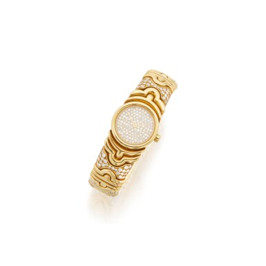 View full screen - View 1 of Lot 51. GOLD AND DIAMOND 'PARENTESI' BRACELET-WATCH, BULGARI.