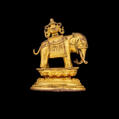 View full screen - View 1 of Lot 1105. A miniature gilt-bronze figure of an elephant supporting a Buddhist vase Himalaya or Southeast Asia, 18th - 19th century | 十八至十九世紀 喜馬拉雅或東南亞 鎏金銅太平有象擺件.