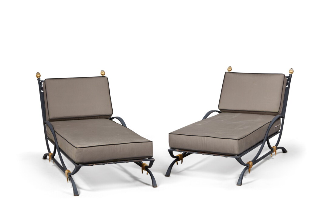 View full screen - View 1 of Lot 190. A Pair Grey/Black Painted and Parcel Gilt Wrought Iron Deck Chairs, Supplied by JP Molyneux Studio Ltd.