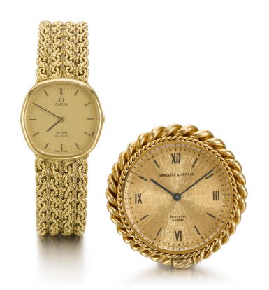 View full screen - View 1 of Lot 1052. VARIOUS, GROUP OF ONE YELLOW GOLD OMEGA BRACELET WATCH AND ONE UNIVERSAL GENEVE MINIATURE DESK CLOCK RETAILED BY VAN CLEEF & ARPELS CIRCA 1980 AND 1970.