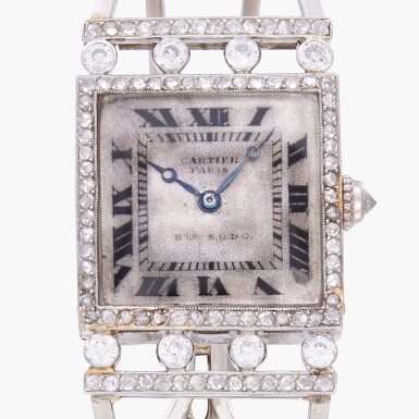 View full screen - View 1 of Lot 126. A rare and early platinum and diamond-set wristwatch with bangle-form bracelet | Circa 1913.