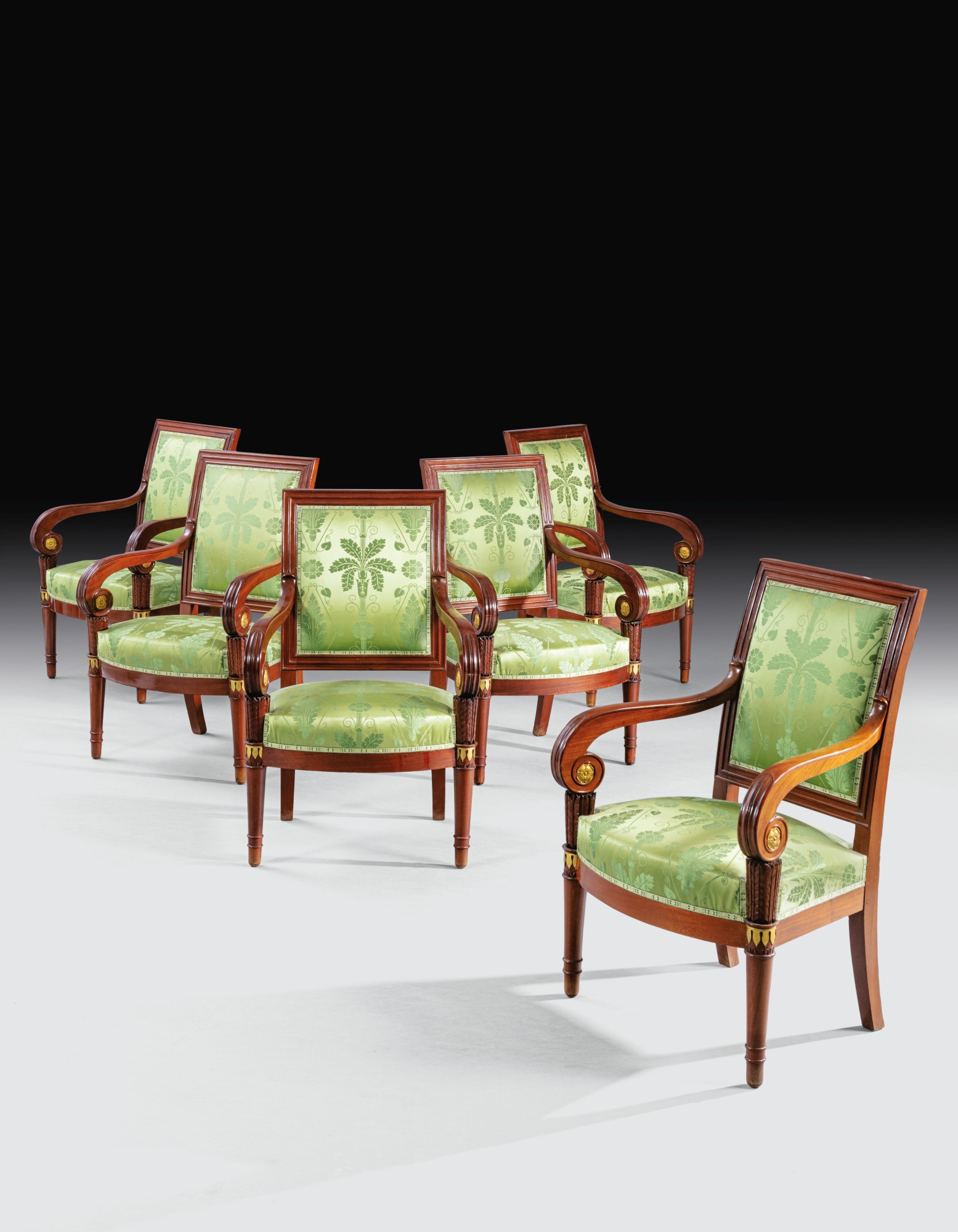 A SET OF SIX GILT-BRONZE MOUNTED MAHOGANY ARMCHAIRS, EMPIRE, EARLY 19TH