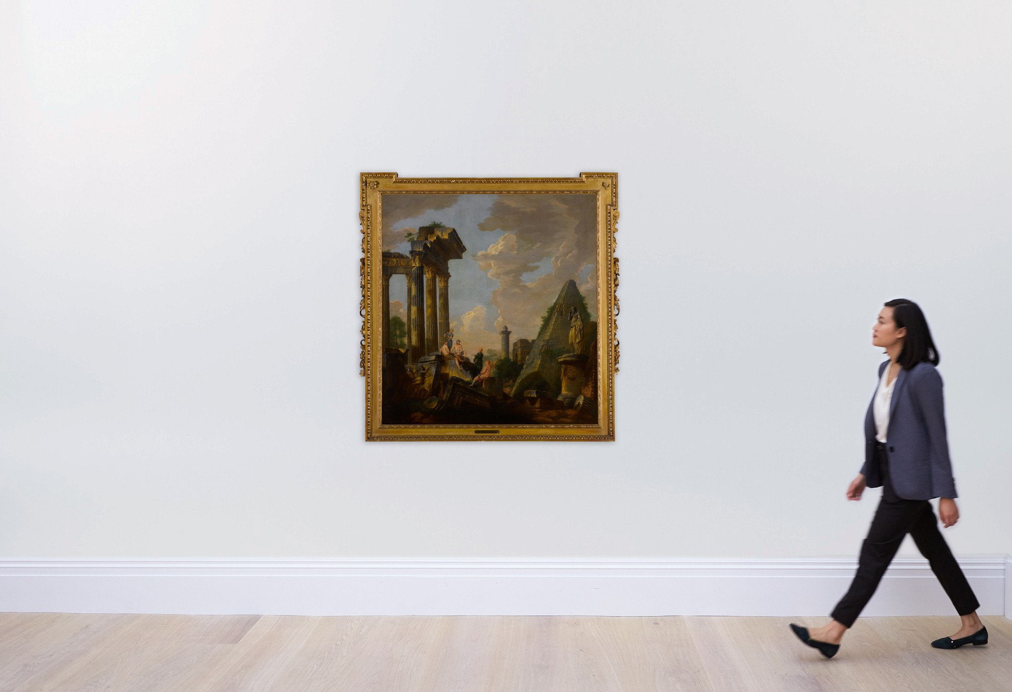 An architectural capriccio with a preaching apostle and figures before ...